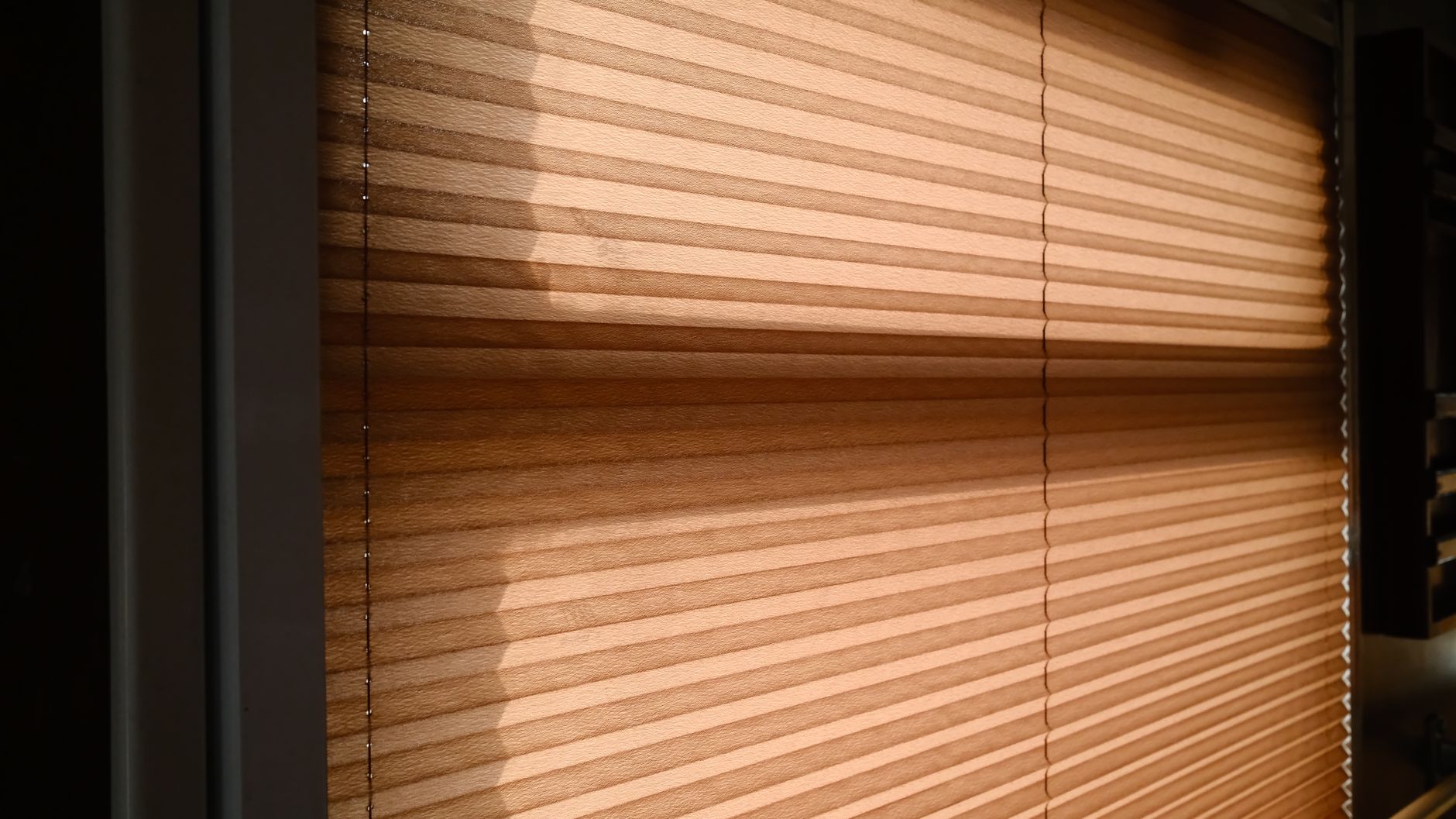 Close the blinds on the sunny side during the day.