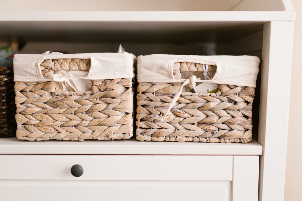Woven storage baskets on a shelf