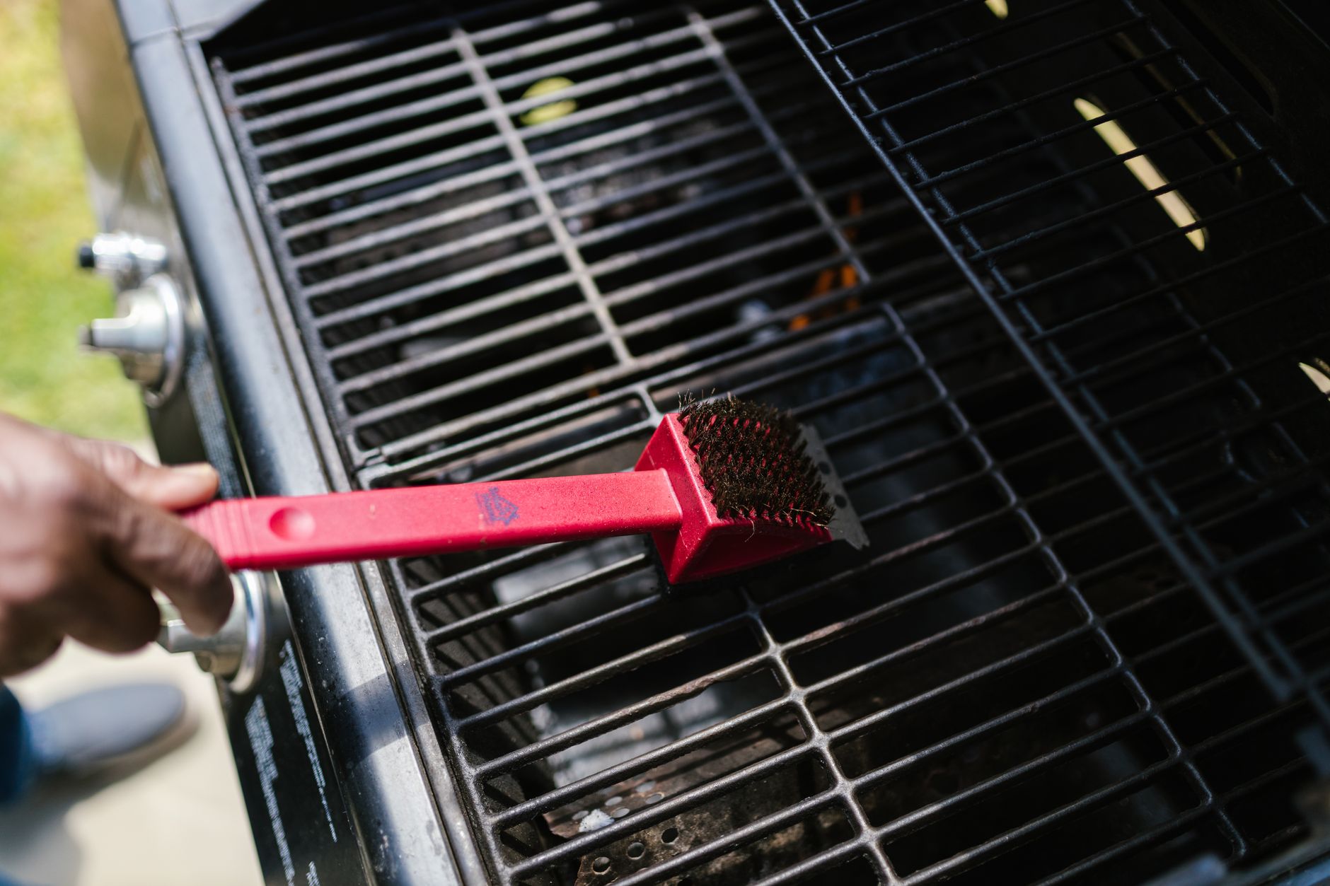 Cool down, brush the grates, and shut off the gas.