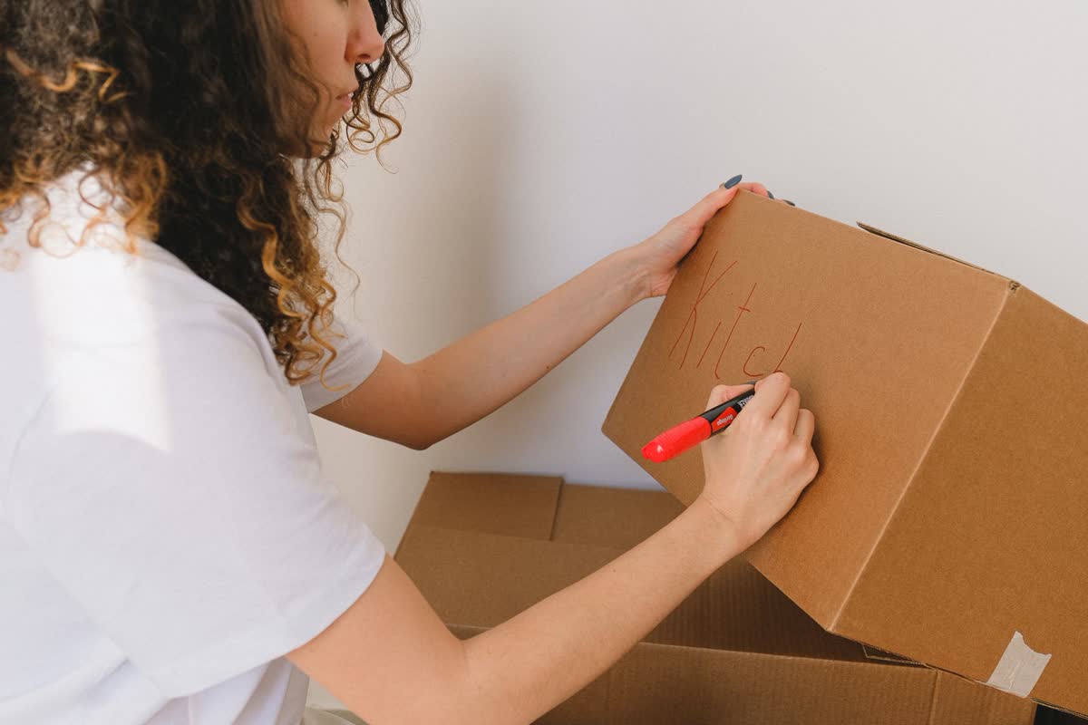 Labeling a moving box with a marker