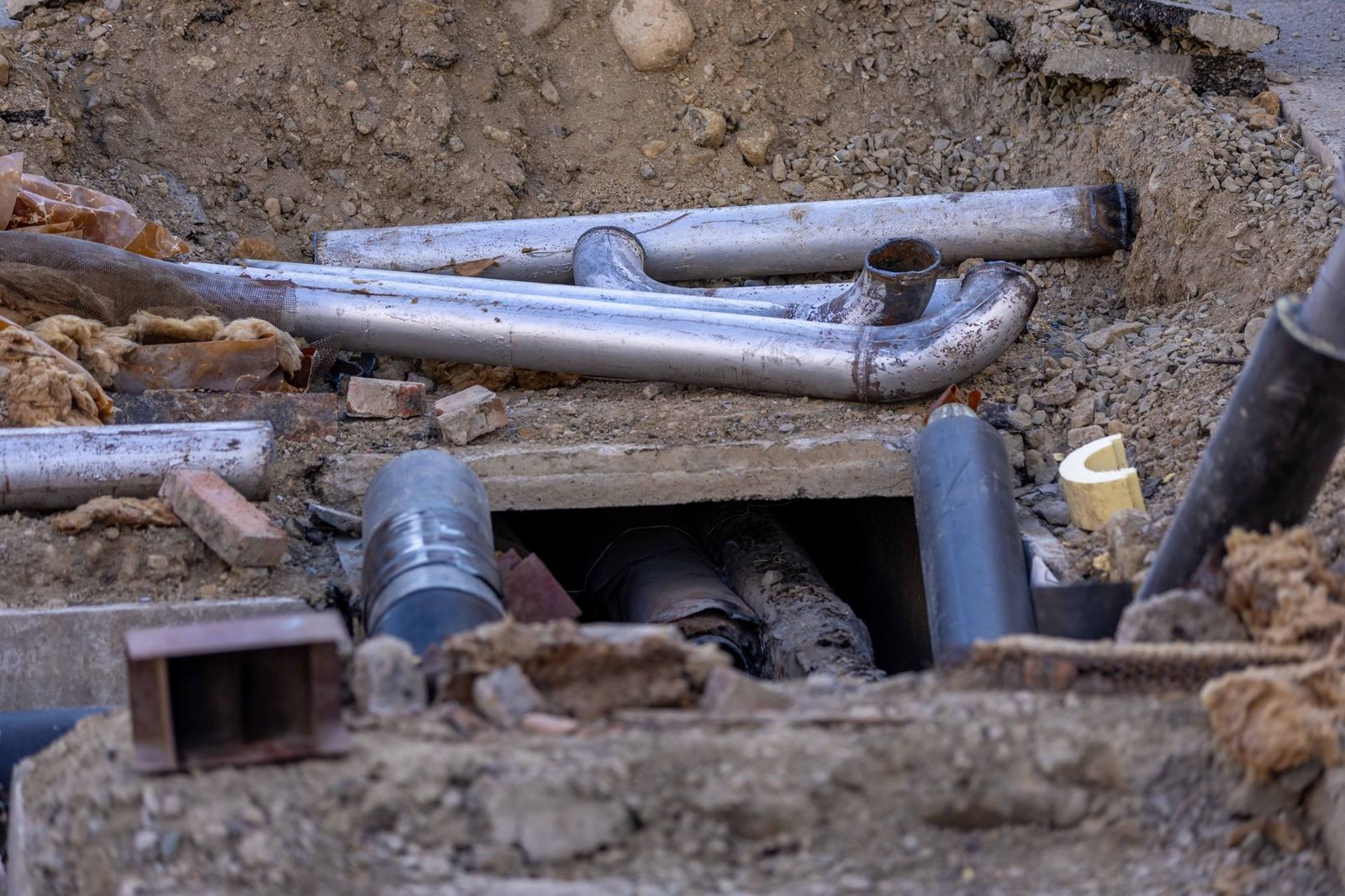Foam insulation sleeves on water pipes